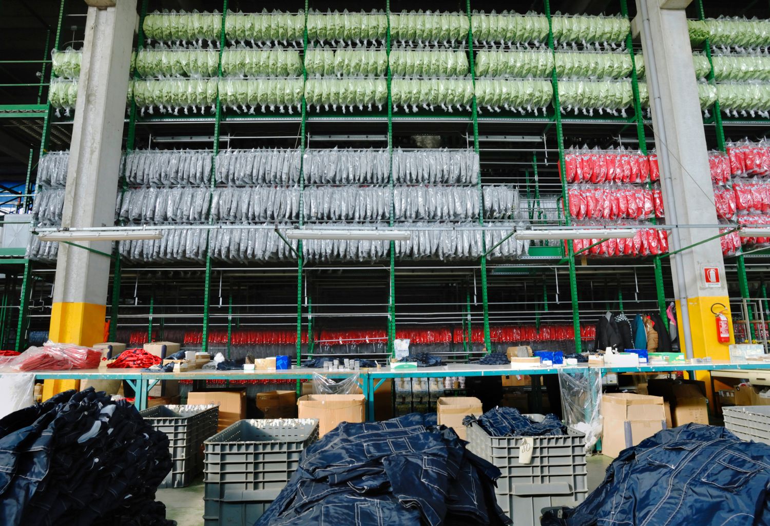 Apparel Manufacturers: Packing of manual clothing in apparel factory, packaged clothes background